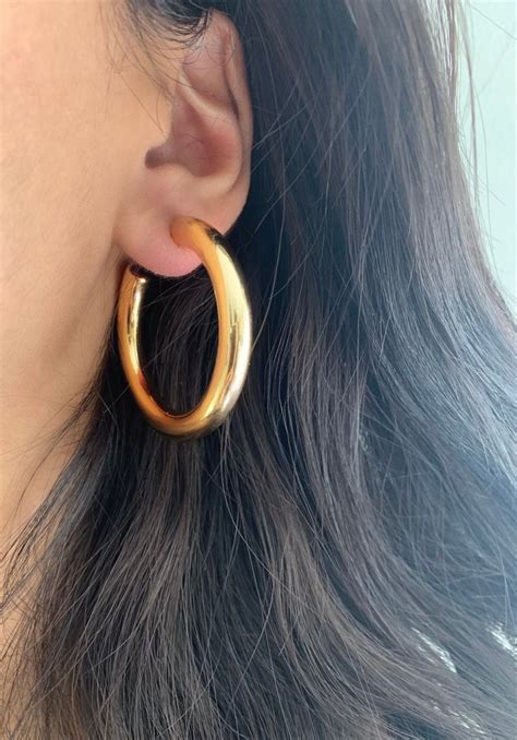 celine gold hoops|Celine.